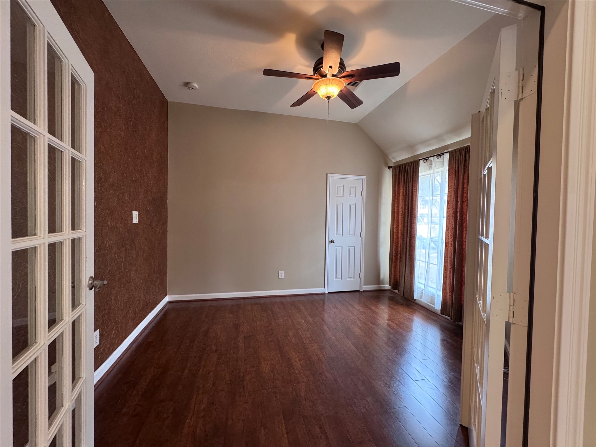 17243 Rush Trace Court Houston, TX 77095 - Photo 38 of 49 a view of an empty room with wooden floor and a window