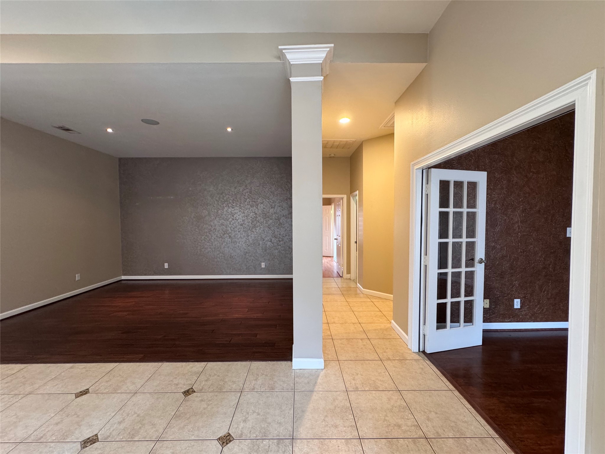 17243 Rush Trace Court Houston, TX 77095 - Photo 39 of 49 a view of hallway with a couch and wooden floor