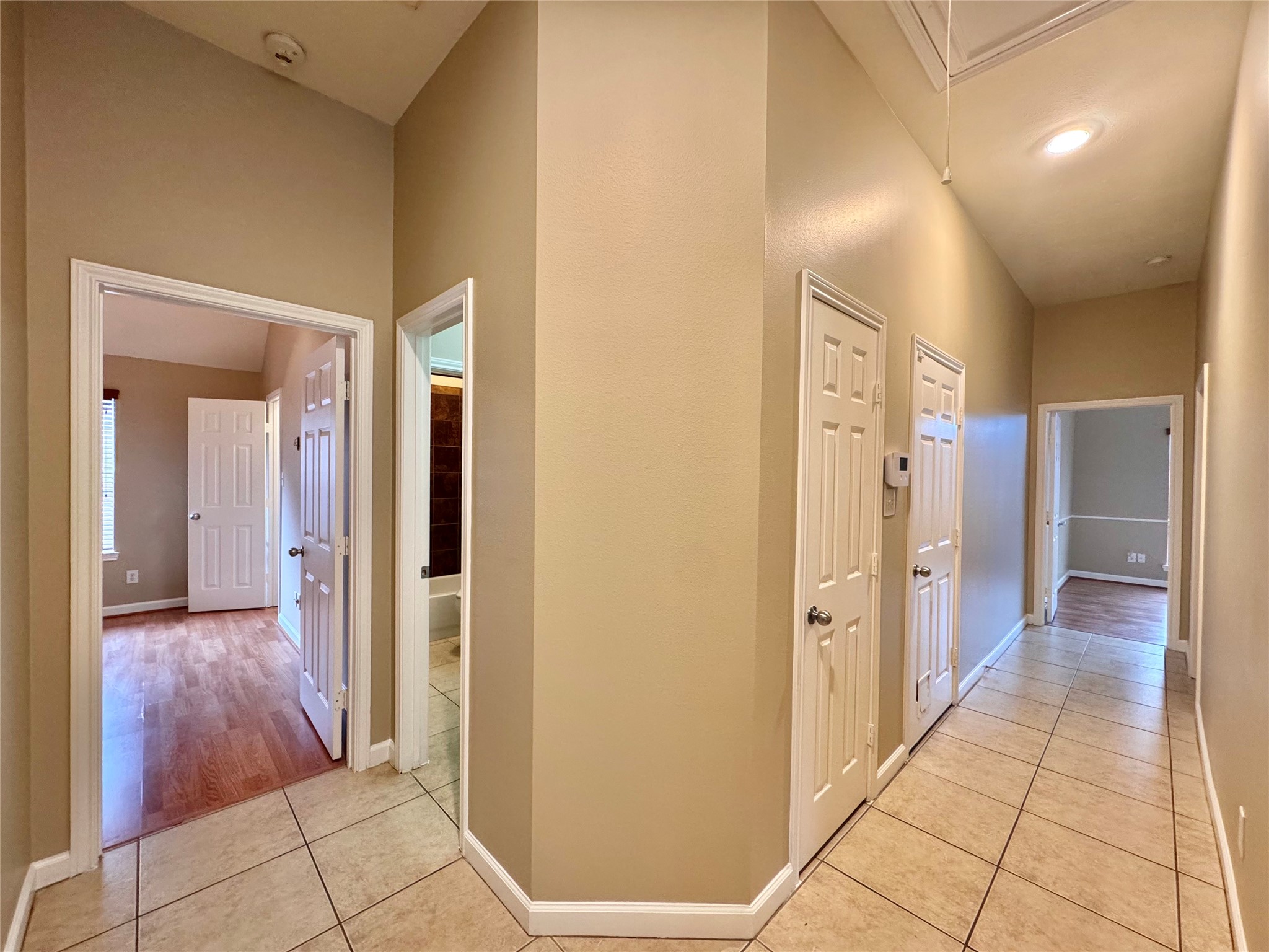 17243 Rush Trace Court Houston, TX 77095 - Photo 40 of 49 a view of a hallway with wooden shelves