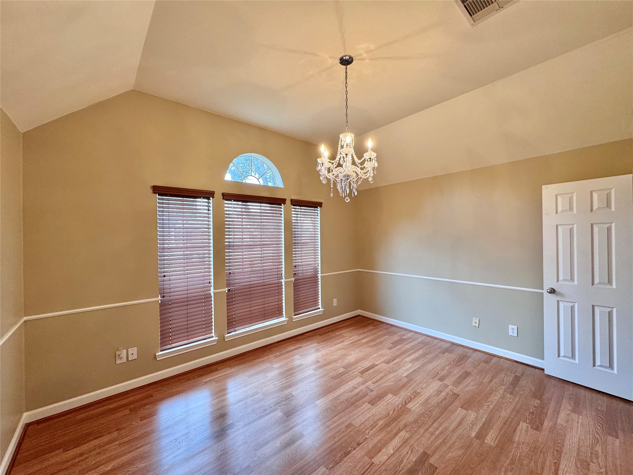 17243 Rush Trace Court Houston, TX 77095 - Photo 42 of 49 a view of an empty room with wooden floor and a window