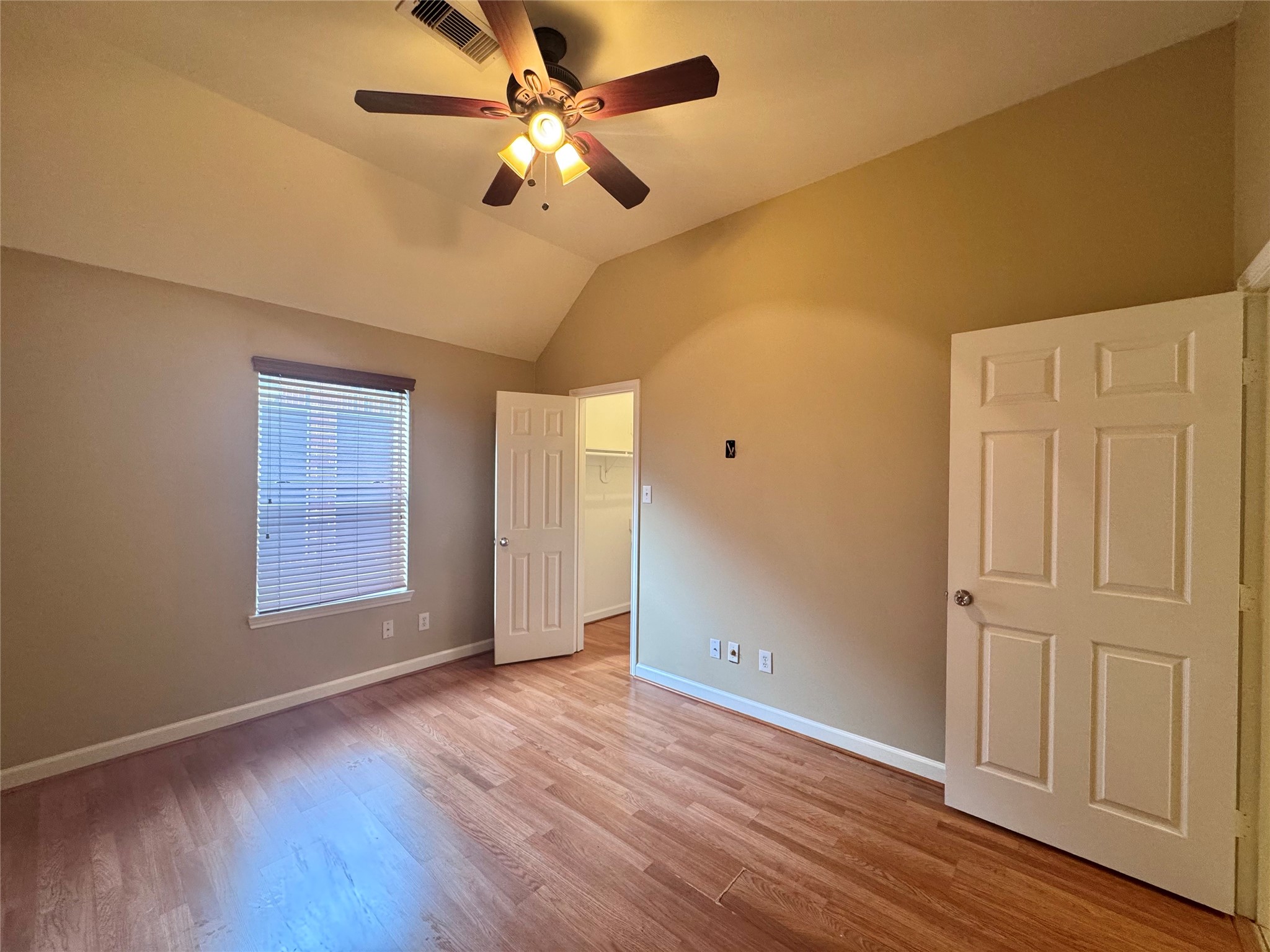 17243 Rush Trace Court Houston, TX 77095 - Photo 45 of 49 a view of an empty room with wooden floor and a window