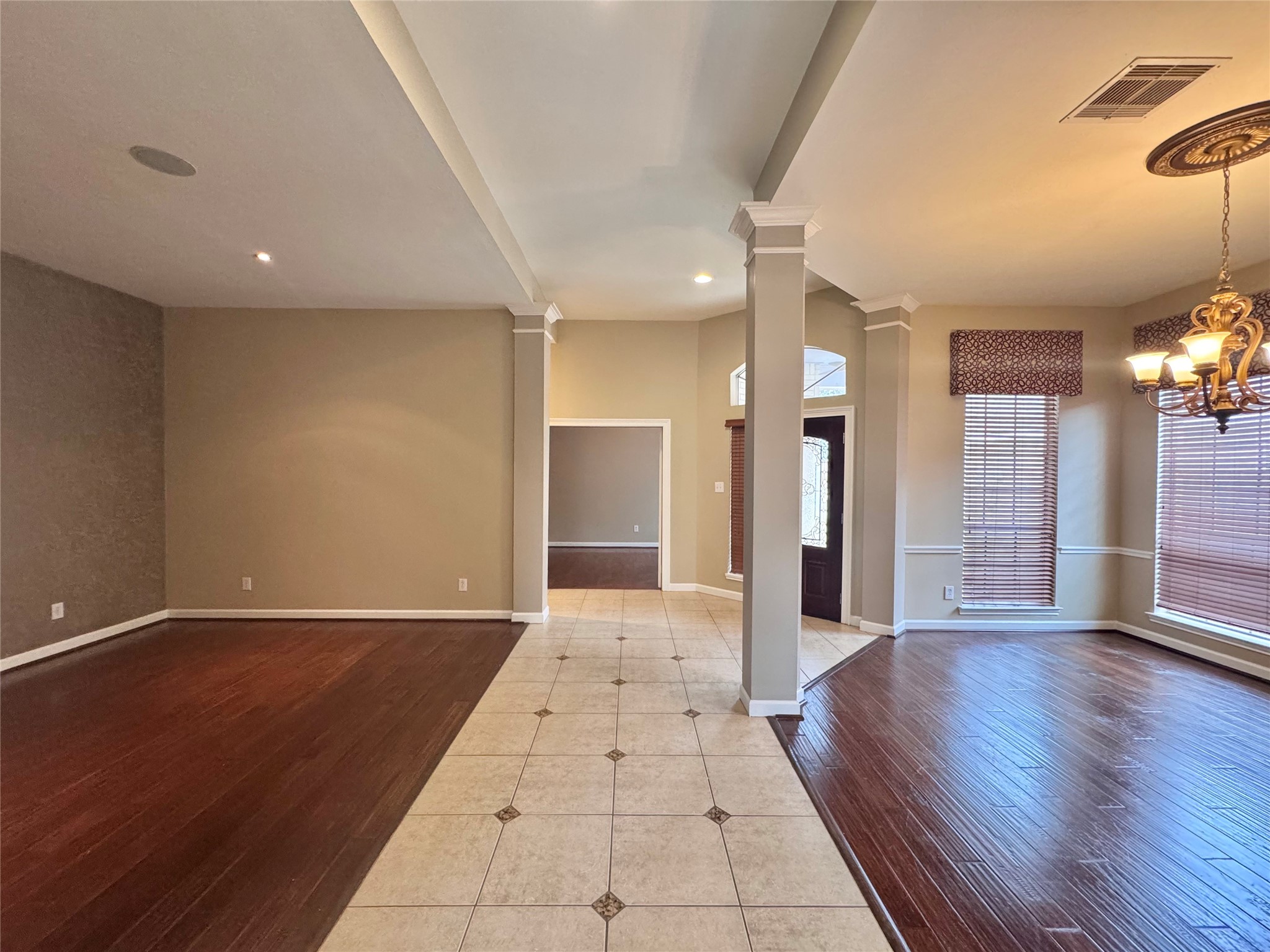 17243 Rush Trace Court Houston, TX 77095 - Photo 9 of 49 an empty room with wooden floor and windows