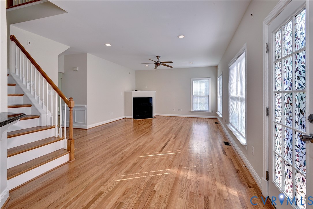 11385 Winding River Road Providence Forge, VA 23140 - Photo 20 of 43 a view of an empty room with wooden floor and a window