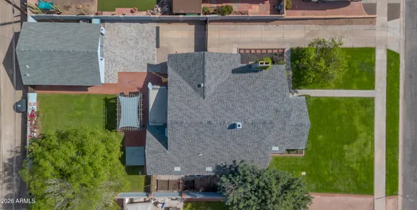 an aerial view of a house with a yard