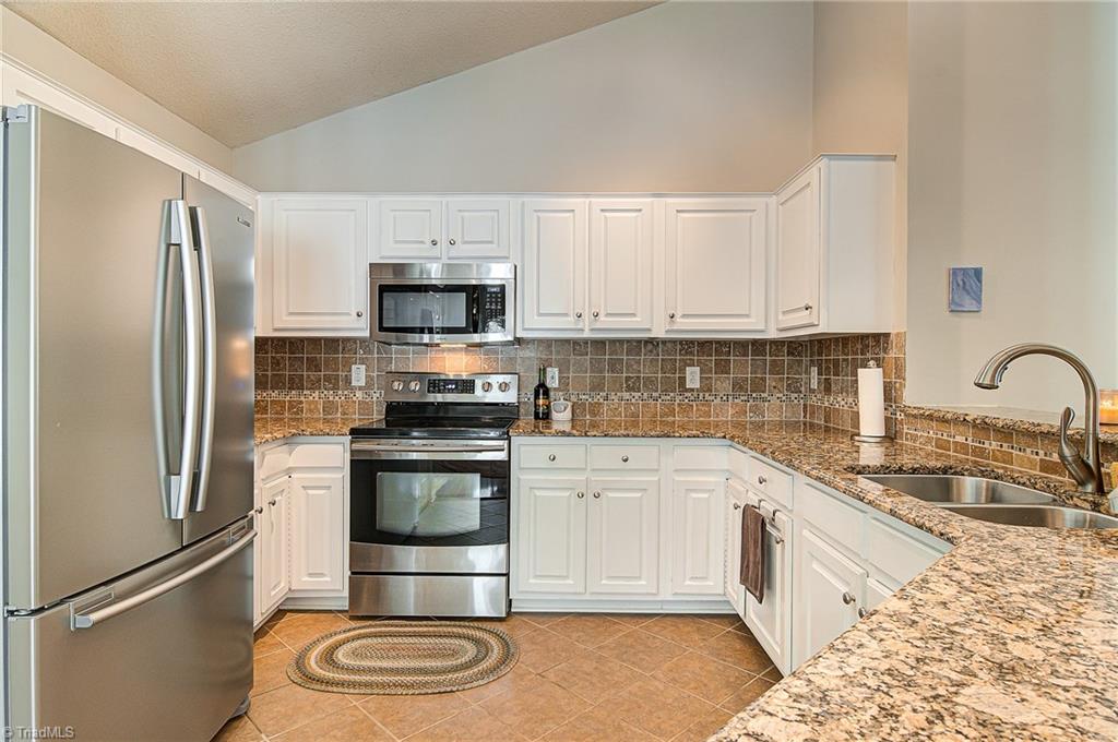 5605 Broadleaf Road Summerfield, NC 27358 - Photo 13 of 27 Open kitchen allows for ample countertop and cabinet space.