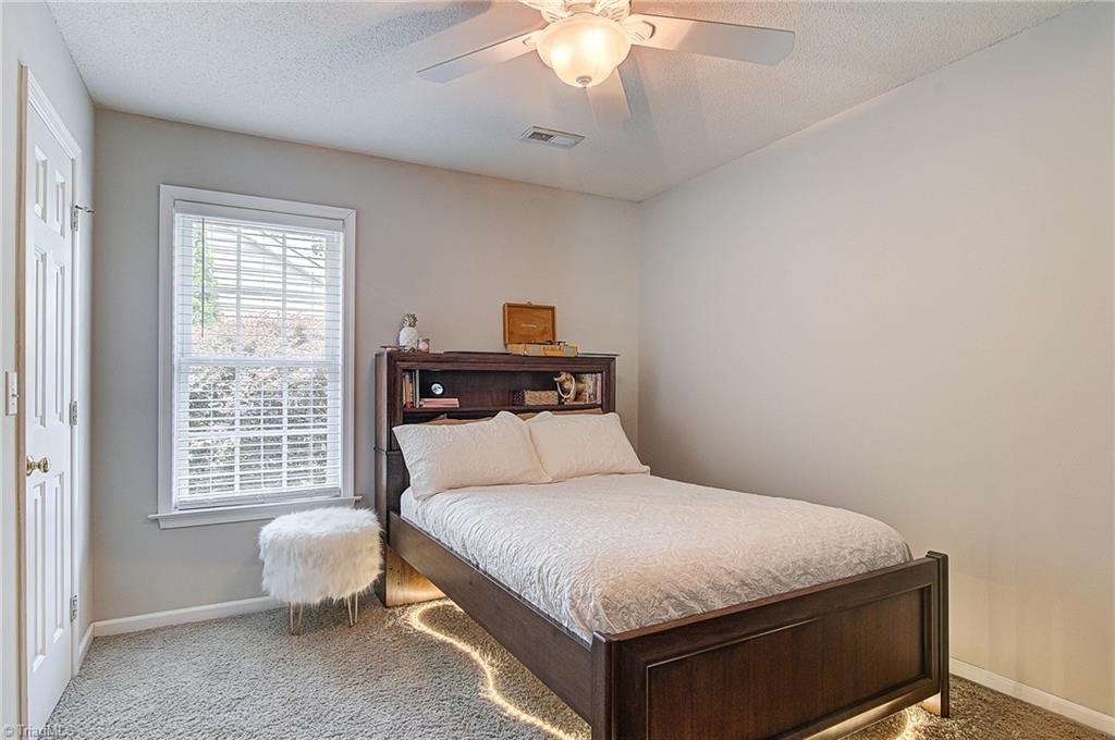 5605 Broadleaf Road Summerfield, NC 27358 - Photo 18 of 27 Spacious second bedroom has a ceiling fan and good size closet