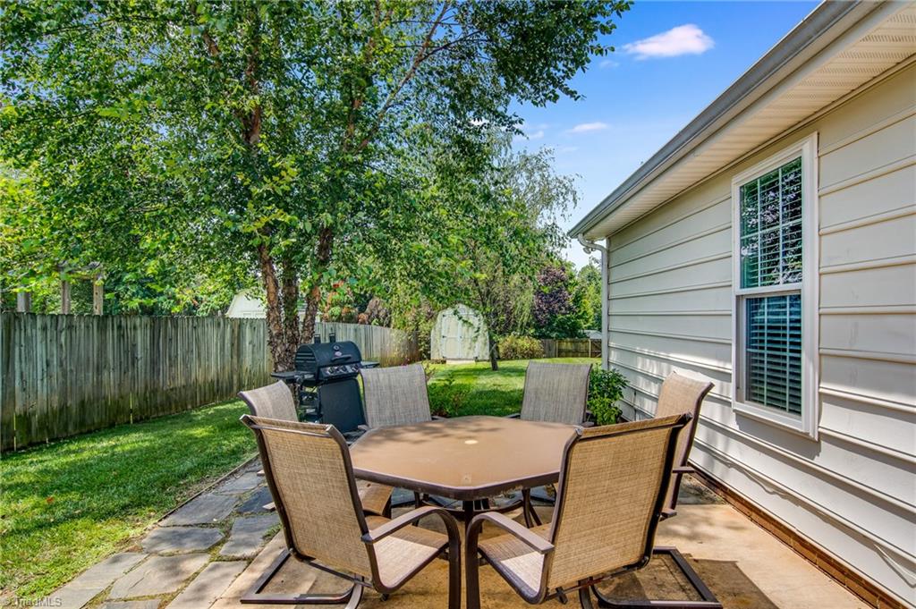 5605 Broadleaf Road Summerfield, NC 27358 - Photo 24 of 27 Fenced backyard and partially shaded patio are ready for your outdoor enjoyment!
