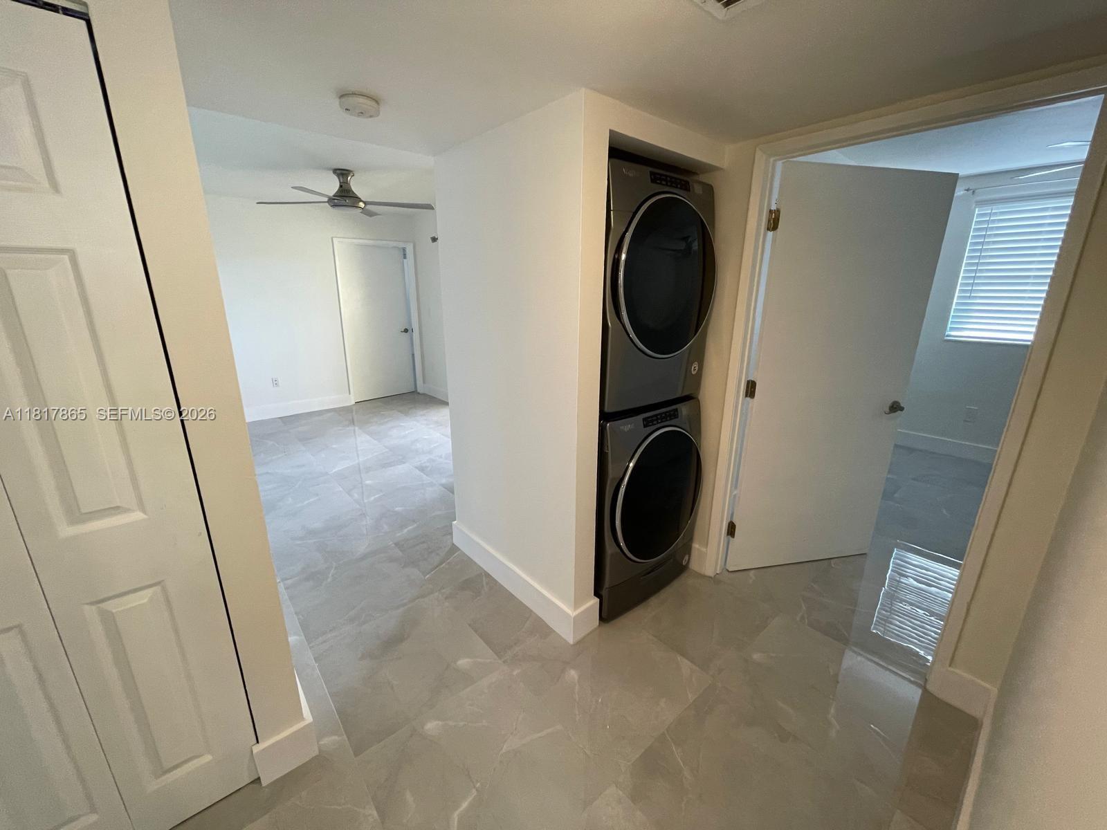 14921 Southwest 82nd Lane, Unit 19508 Miami, FL 33193 - Photo 18 of 31 a utility room with dryer and washer