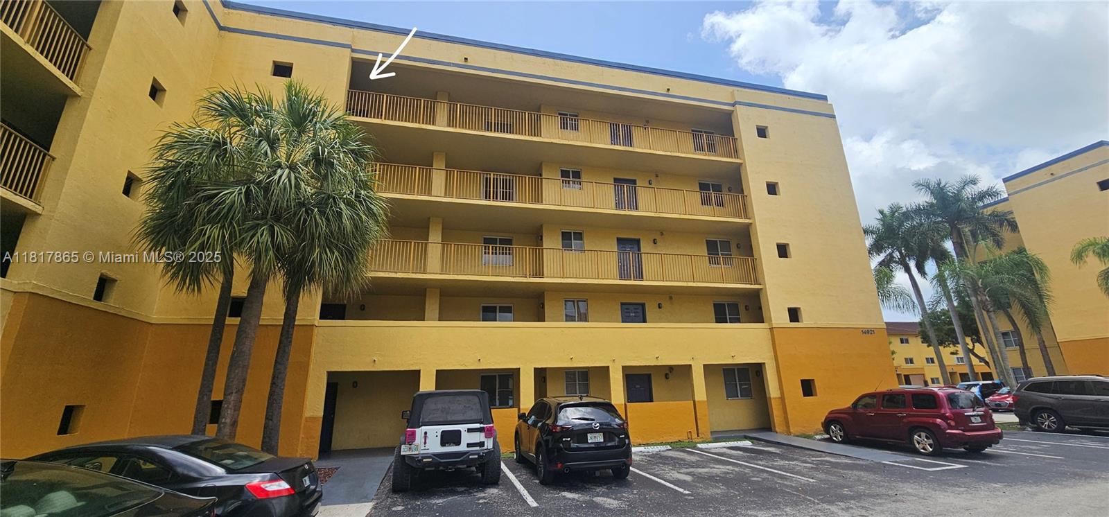 14921 Southwest 82nd Lane, Unit 19508 Miami, FL 33193 - Photo 20 of 31 a front view of a building with parking space