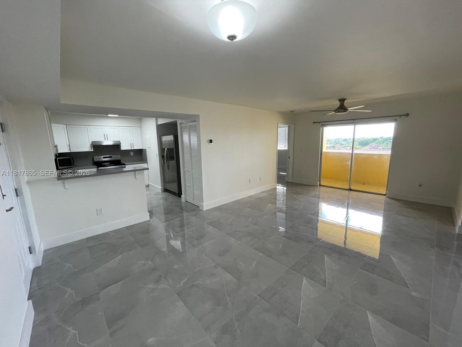 14921 Southwest 82nd Lane, Unit 19508 Miami, FL 33193 - Photo 2 of 31 a view of a kitchen with a sink and a window