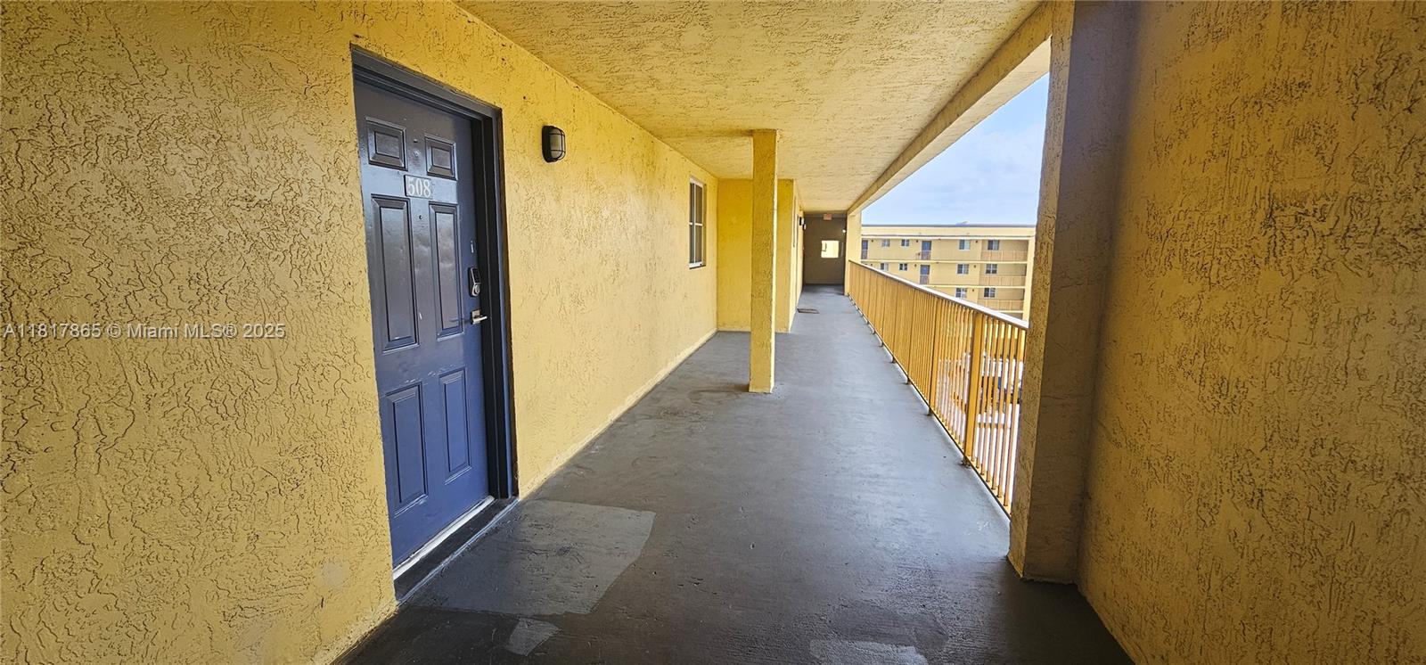 14921 Southwest 82nd Lane, Unit 19508 Miami, FL 33193 - Photo 24 of 31 a view of a hallway with wooden floor and staircase