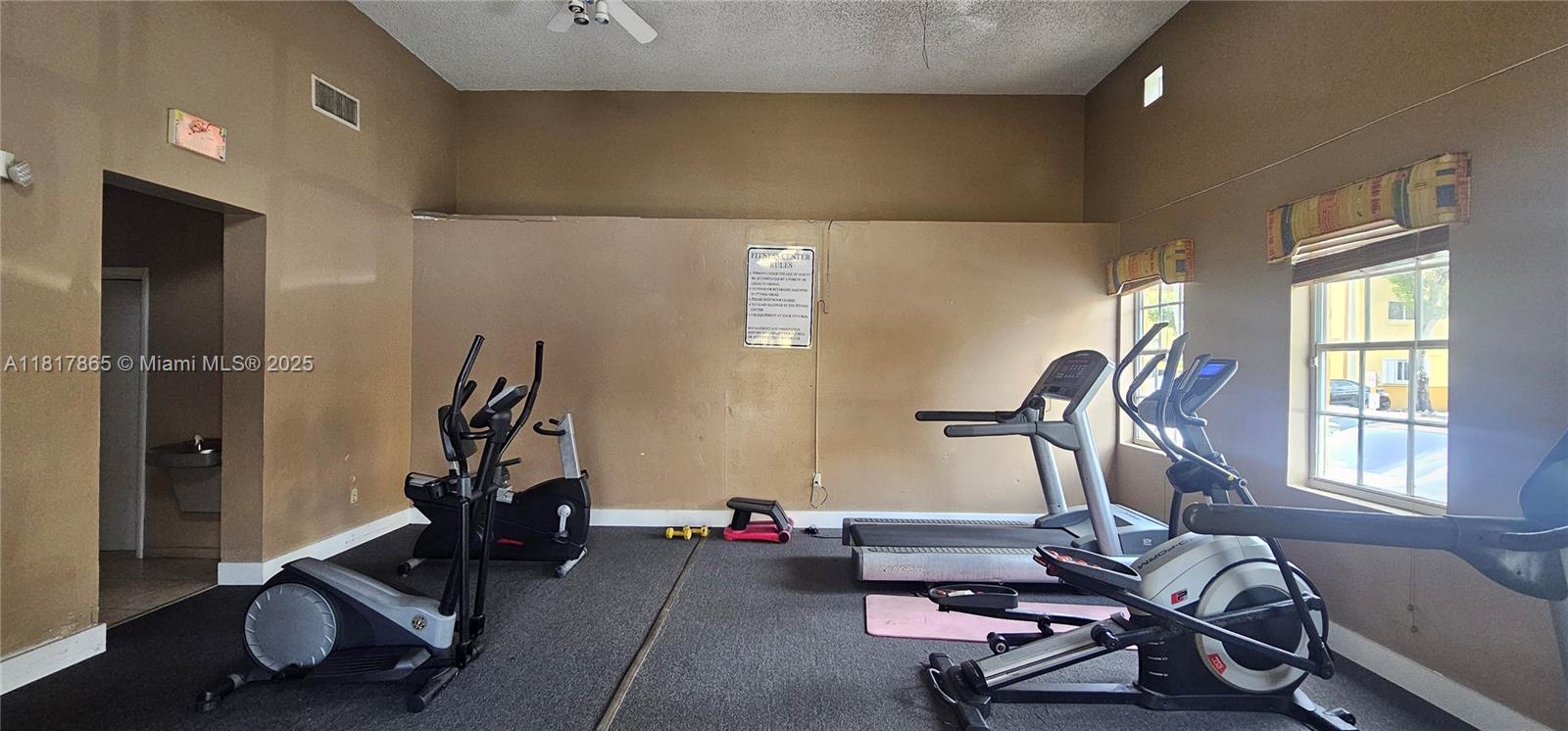 14921 Southwest 82nd Lane, Unit 19508 Miami, FL 33193 - Photo 29 of 31 a living room with furniture and a window