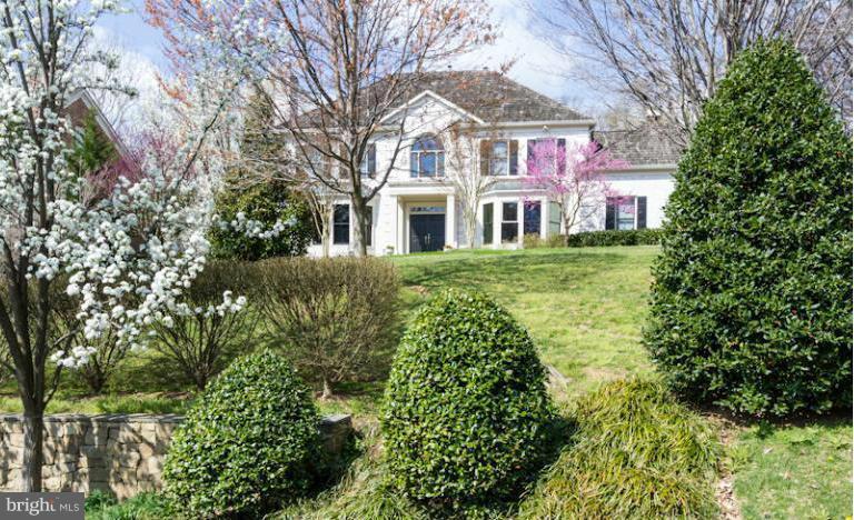 1338 Kirby Road McLean, VA 22101 - Photo 1 of 30 a front view of a house with garden