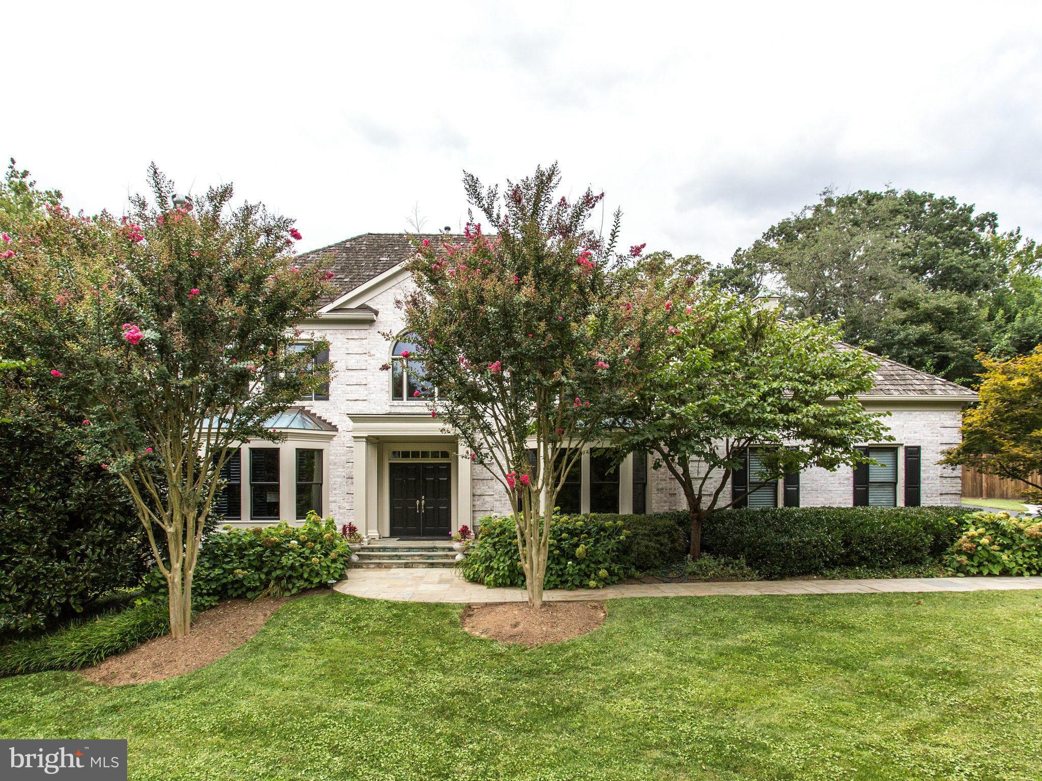 1338 Kirby Road McLean, VA 22101 - Photo 2 of 30 a front view of a house with a yard garage and outdoor seating