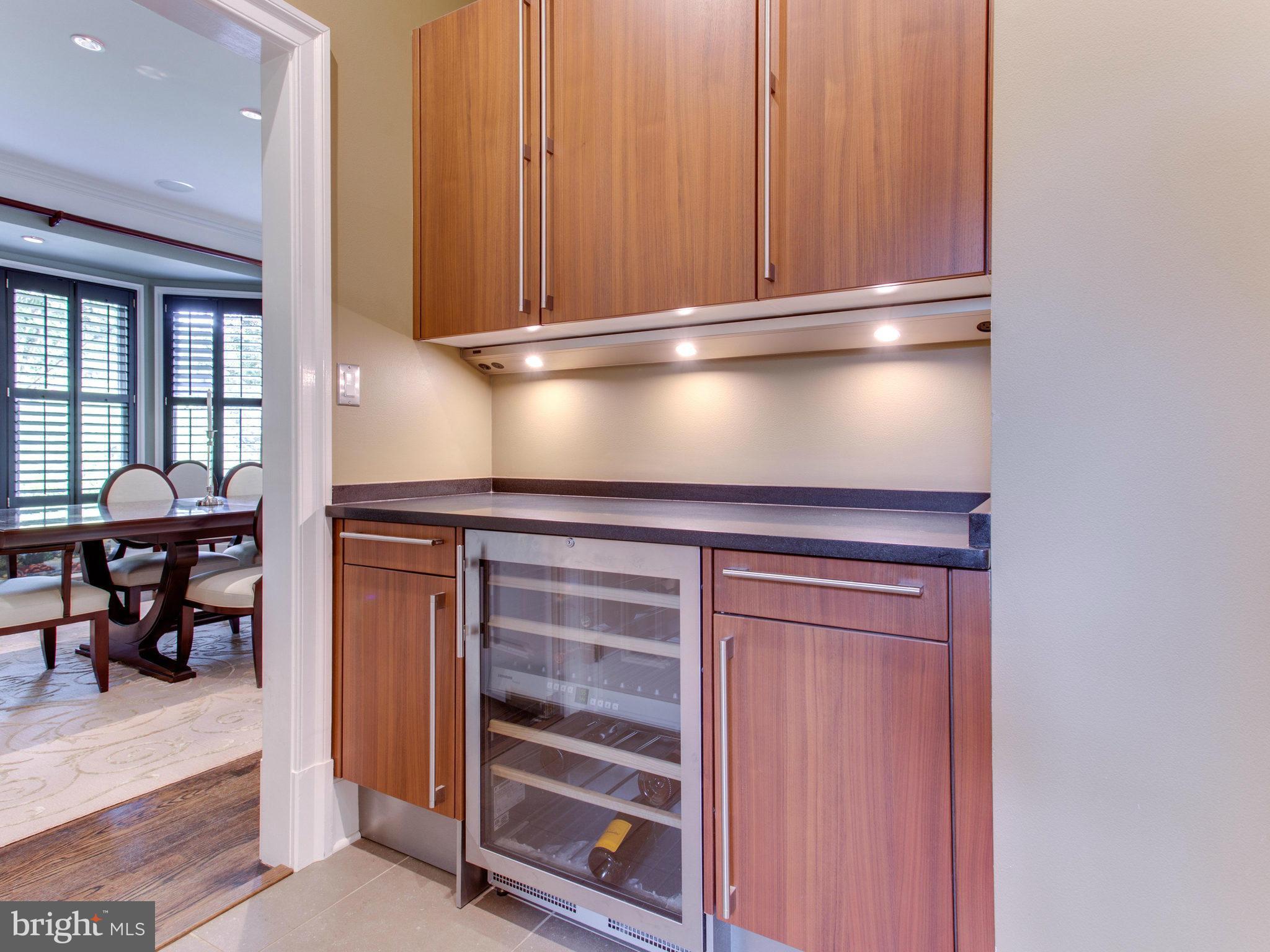 1338 Kirby Road McLean, VA 22101 - Photo 11 of 30 a kitchen with a refrigerator and table