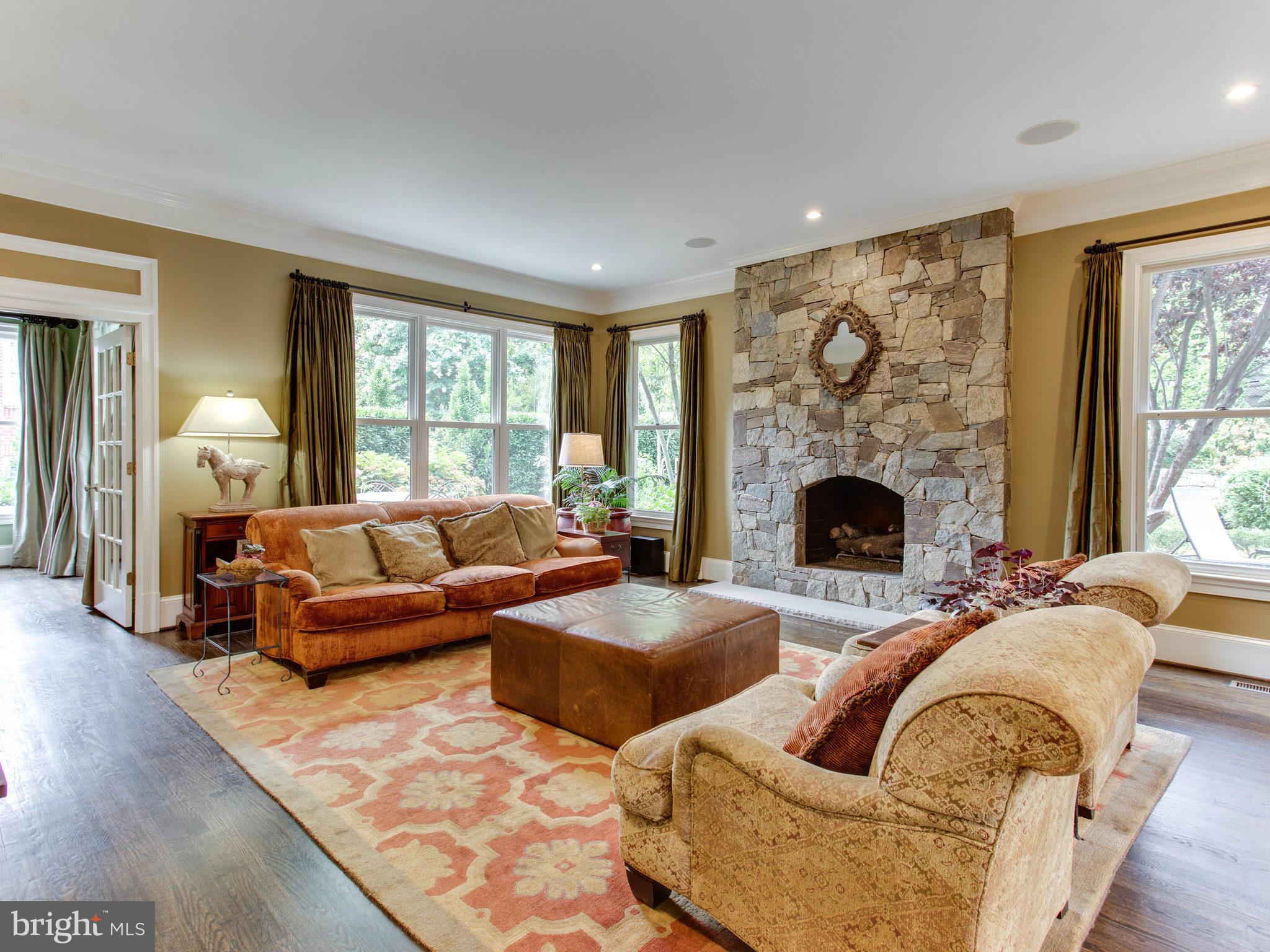 1338 Kirby Road McLean, VA 22101 - Photo 15 of 30 a living room with furniture large window and a fireplace