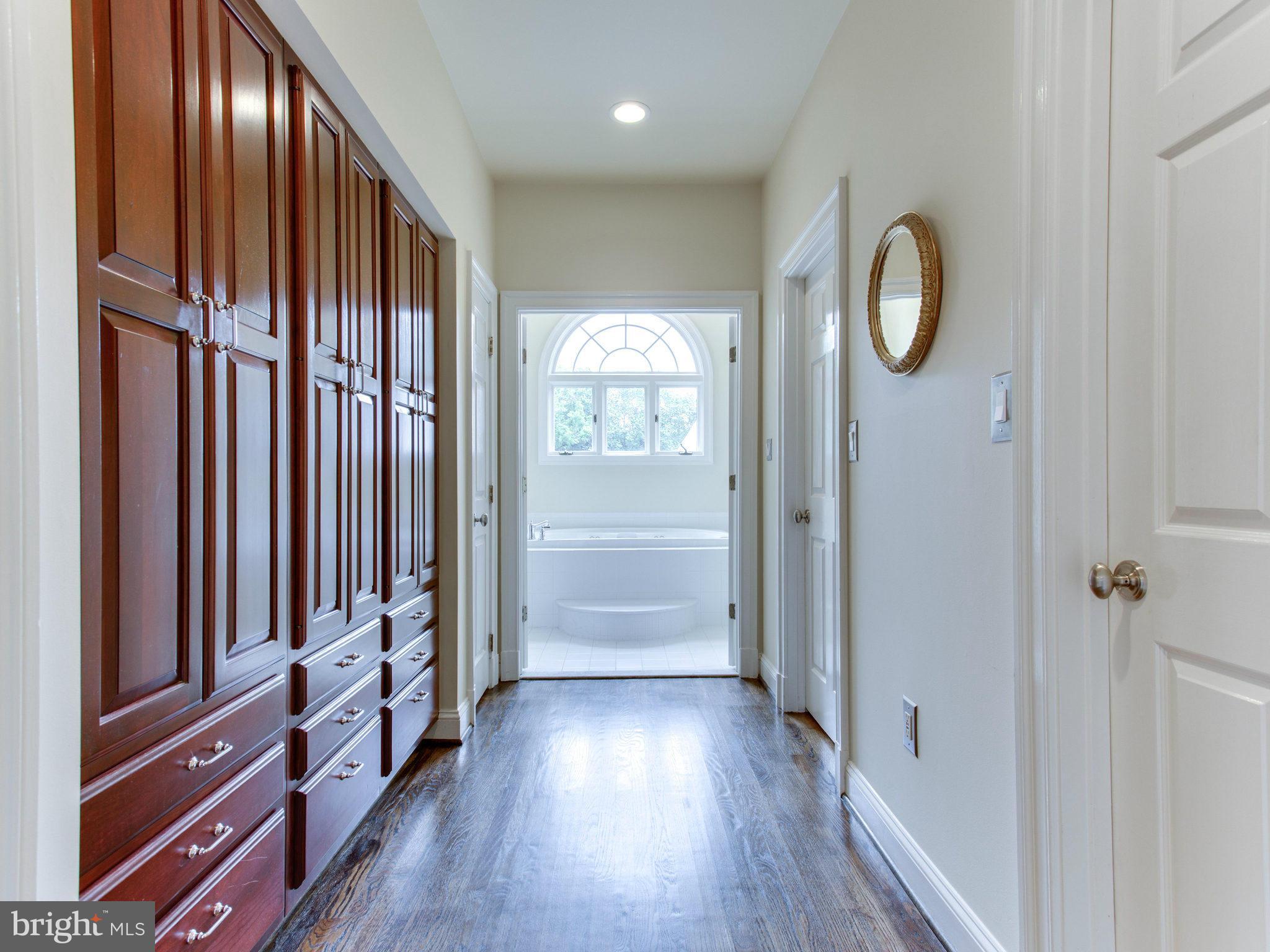 1338 Kirby Road McLean, VA 22101 - Photo 18 of 30 a view of a hallway with wooden floor and windows
