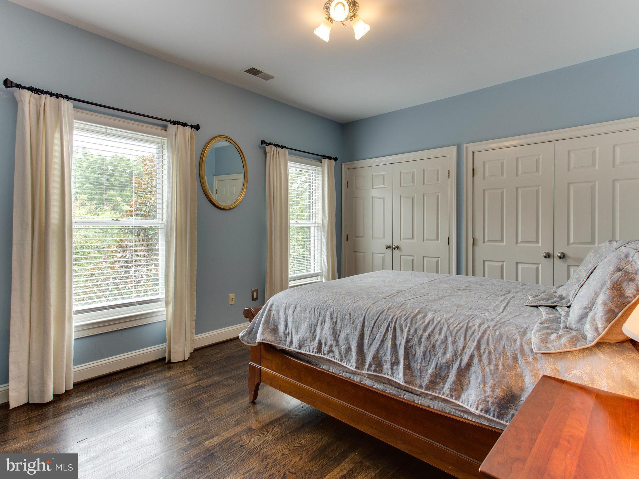 1338 Kirby Road McLean, VA 22101 - Photo 20 of 30 a bed sitting in a spacious bedroom next to a window