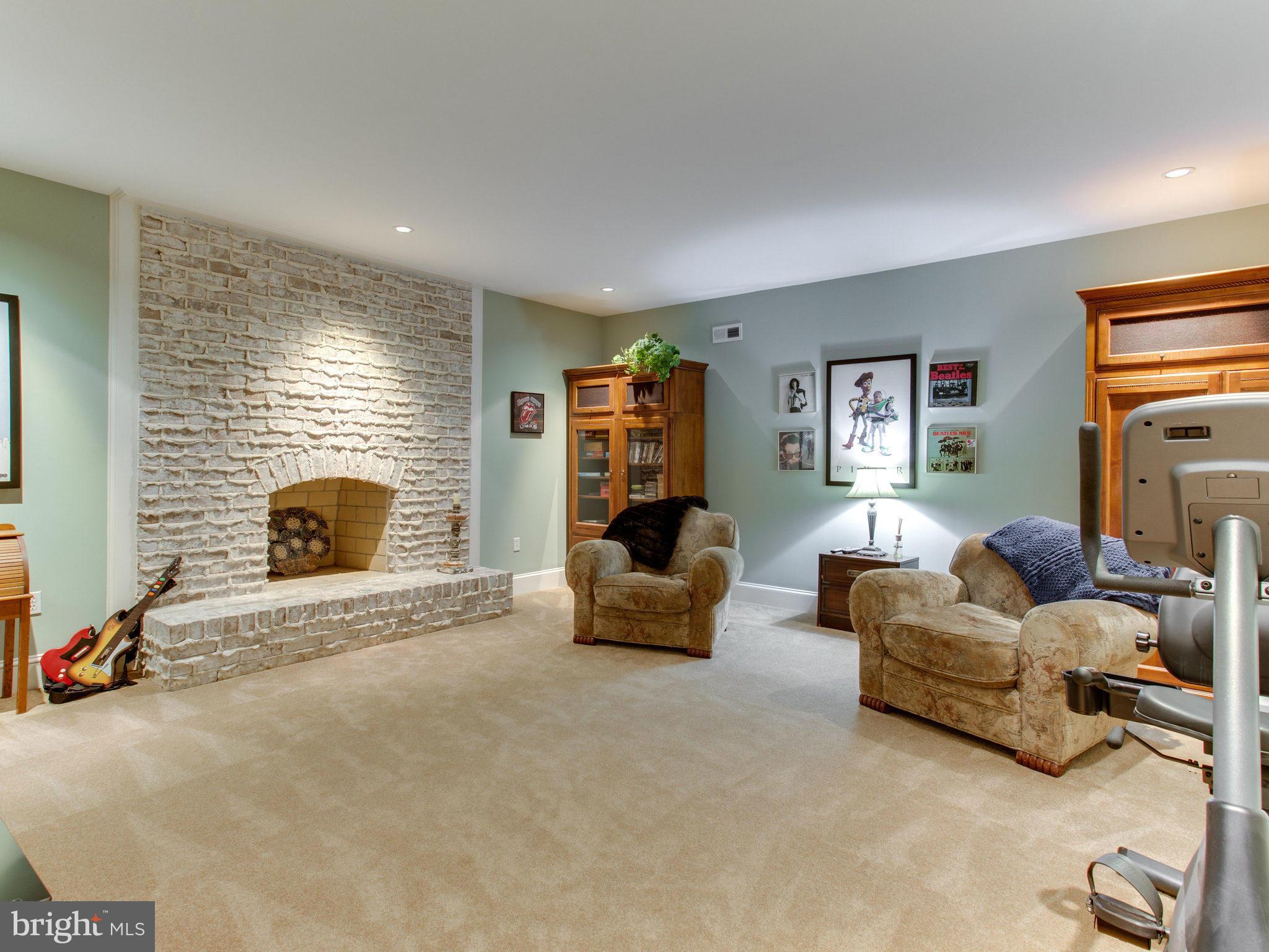 1338 Kirby Road McLean, VA 22101 - Photo 23 of 30 a living room with furniture and a fireplace