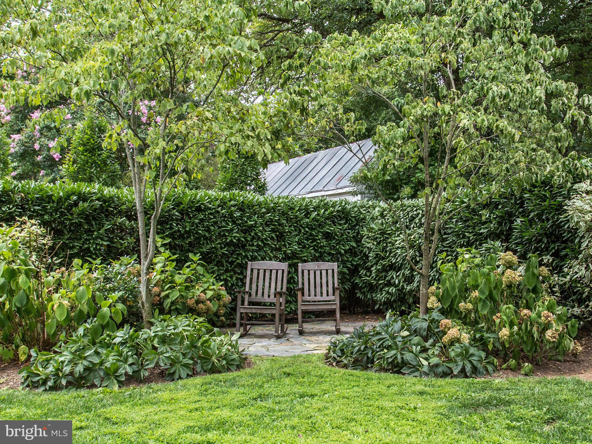 1338 Kirby Road McLean, VA 22101 - Photo 26 of 30 a view of a chair and table in the garden