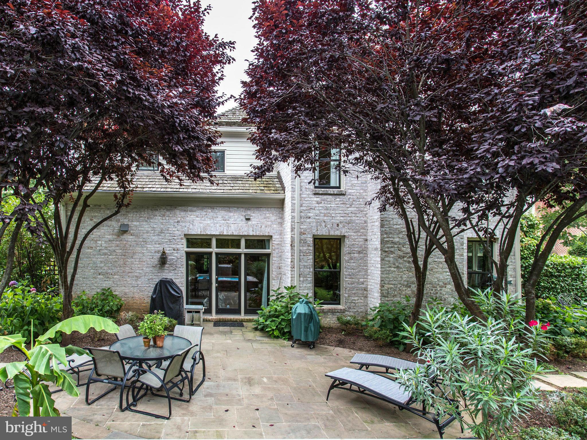 1338 Kirby Road McLean, VA 22101 - Photo 27 of 30 a view of a patio with a table and chairs and a large tree