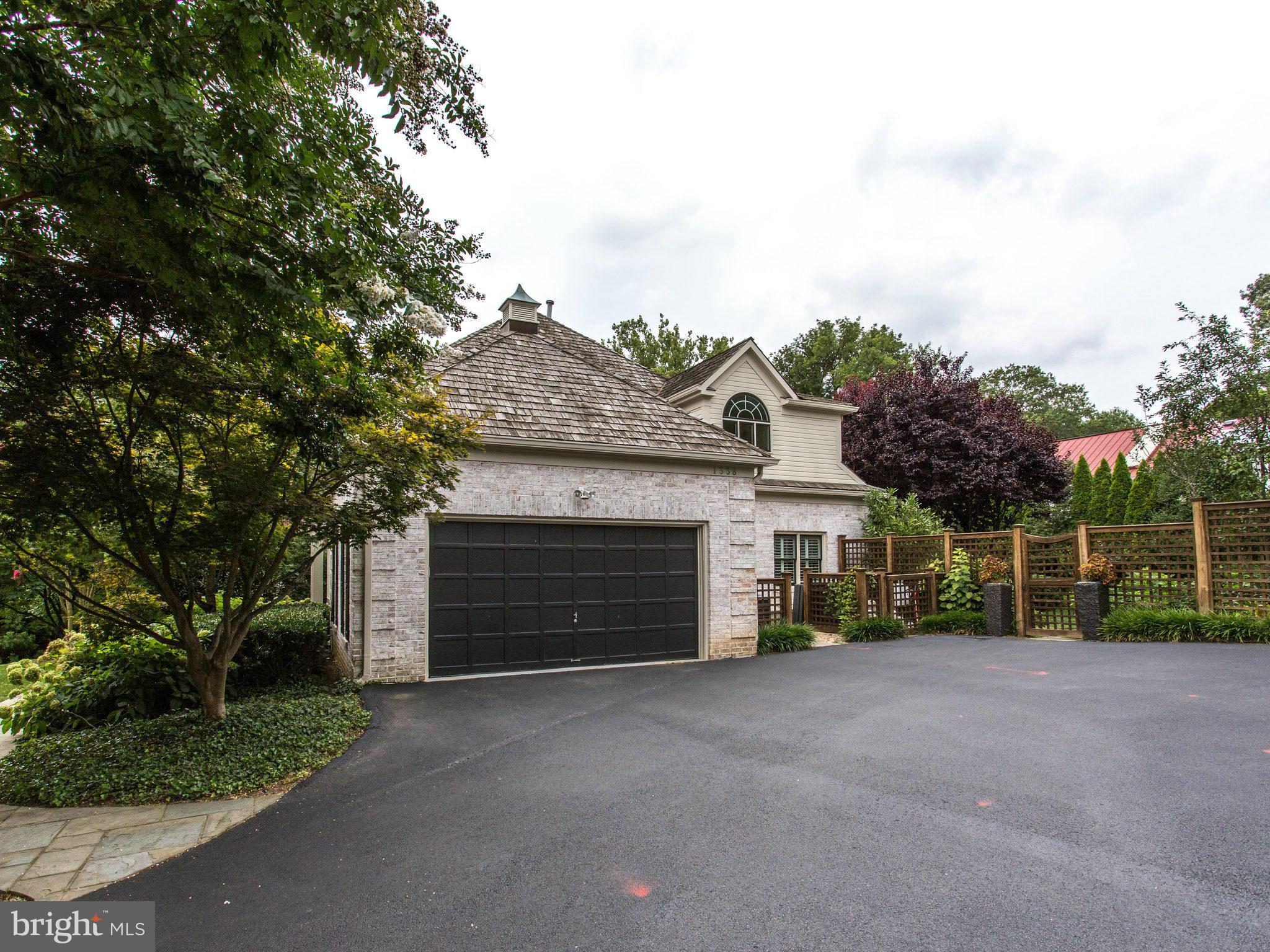 1338 Kirby Road McLean, VA 22101 - Photo 4 of 30 a view of a house with a yard and potted plants
