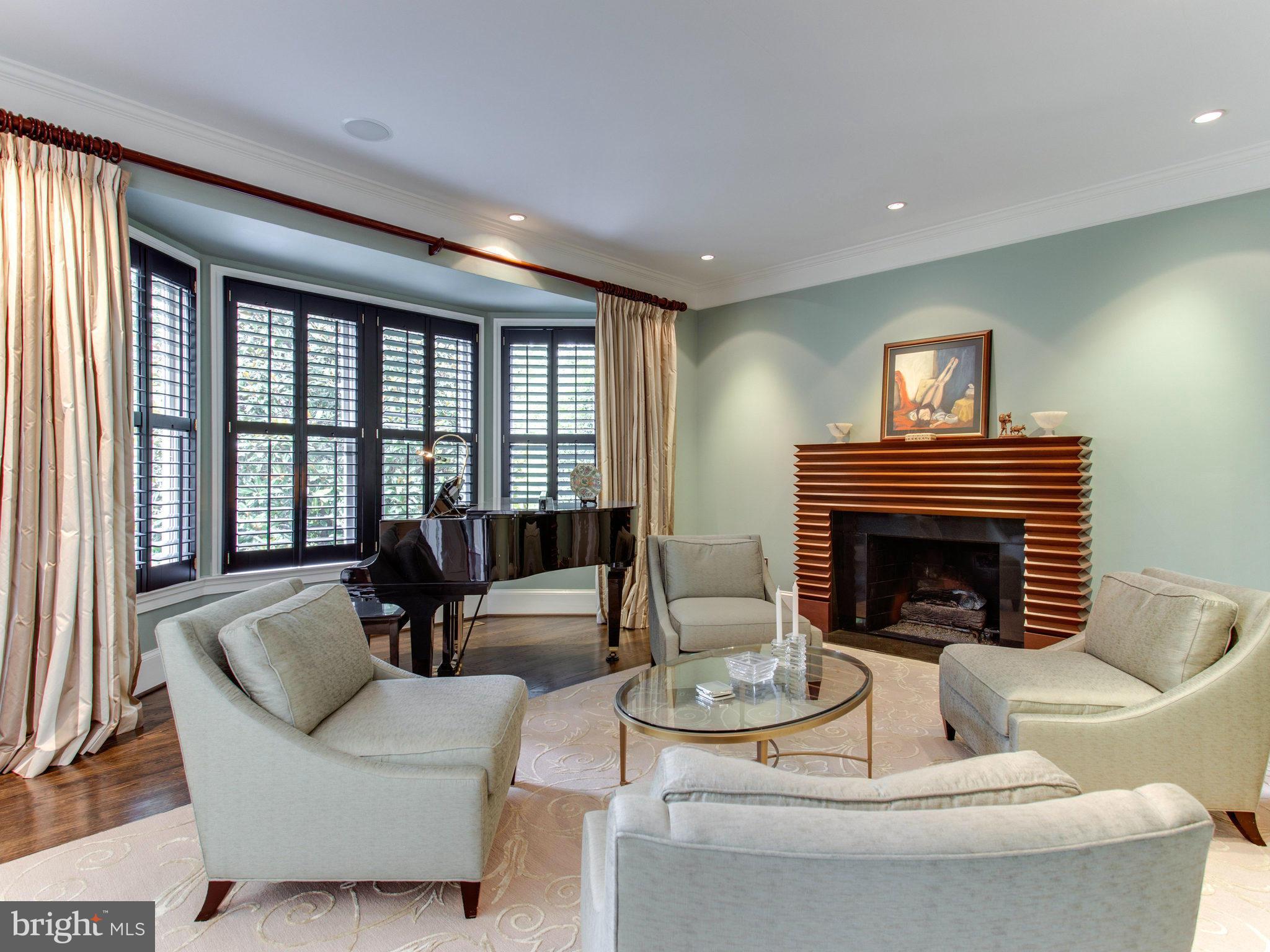 1338 Kirby Road McLean, VA 22101 - Photo 7 of 30 a living room with furniture and a fireplace