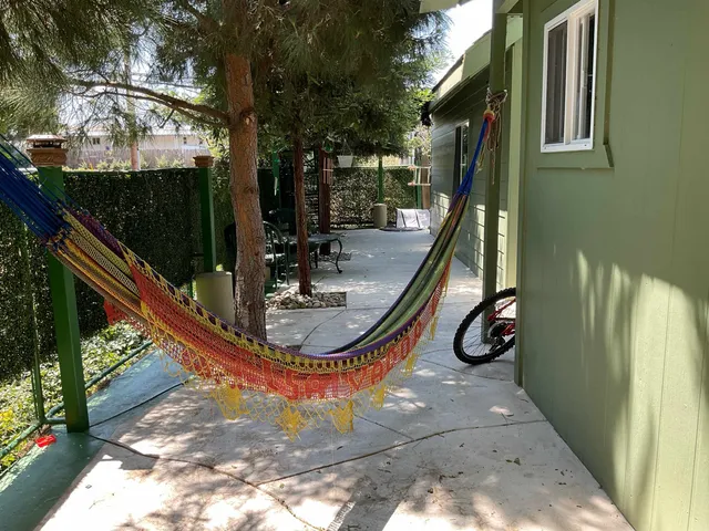 a view of a house with swimming pool and sitting area