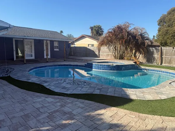 a view of a house with swimming pool