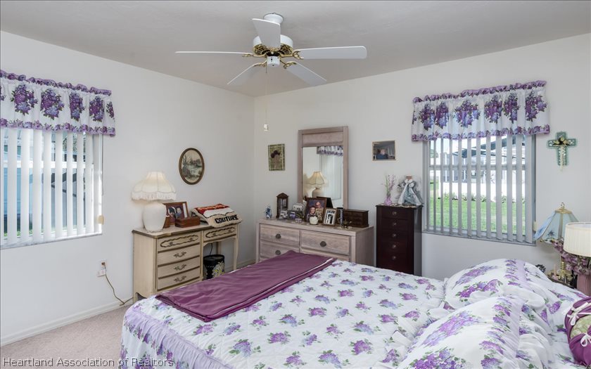 4435 Leaf Road Sebring, FL 33875 - Photo 11 of 16 a bedroom with a bed and a dresser in it