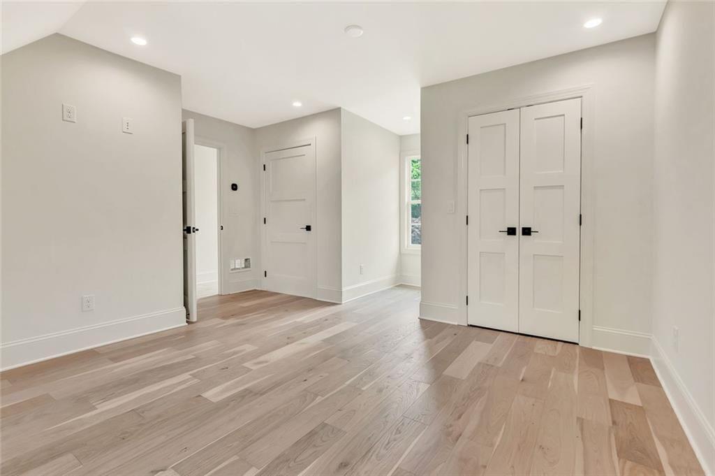 124 Morgan Street Senoia, GA 30276 - Photo 19 of 25 a view of an empty room with wooden floor