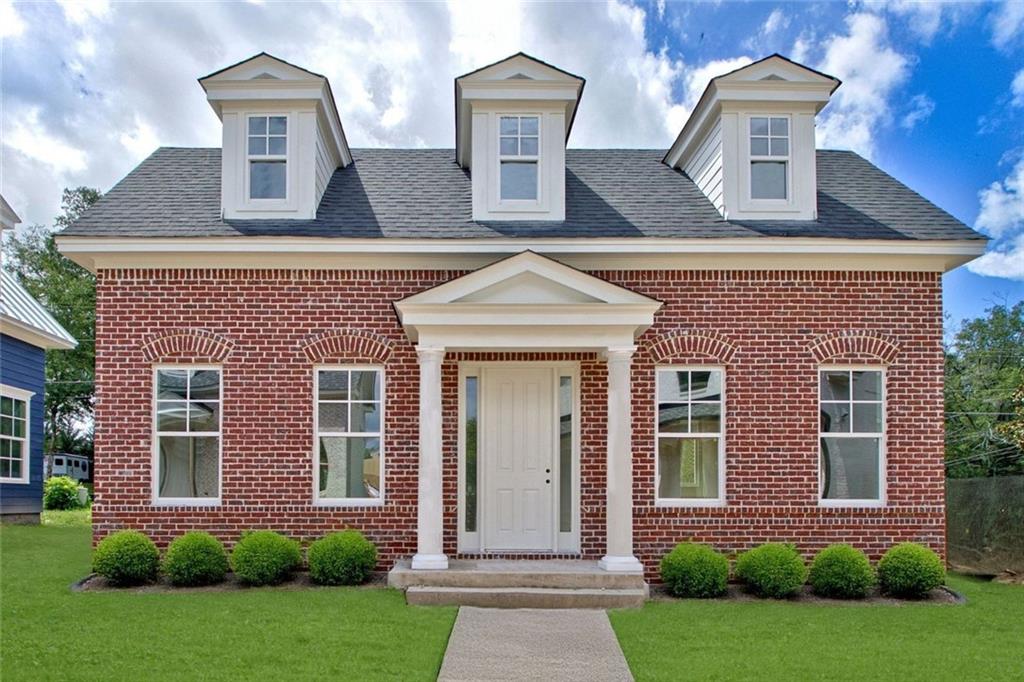 124 Morgan Street Senoia, GA 30276 - Photo 2 of 25 front view of house with a yard