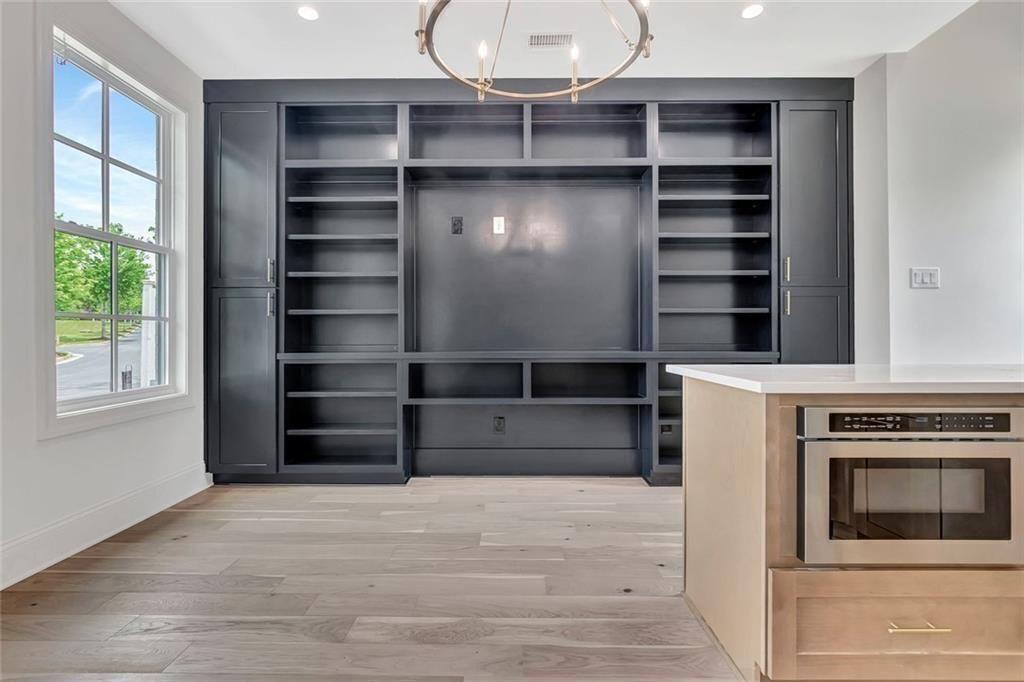 124 Morgan Street Senoia, GA 30276 - Photo 10 of 25 a view of wooden floor and windows in a room