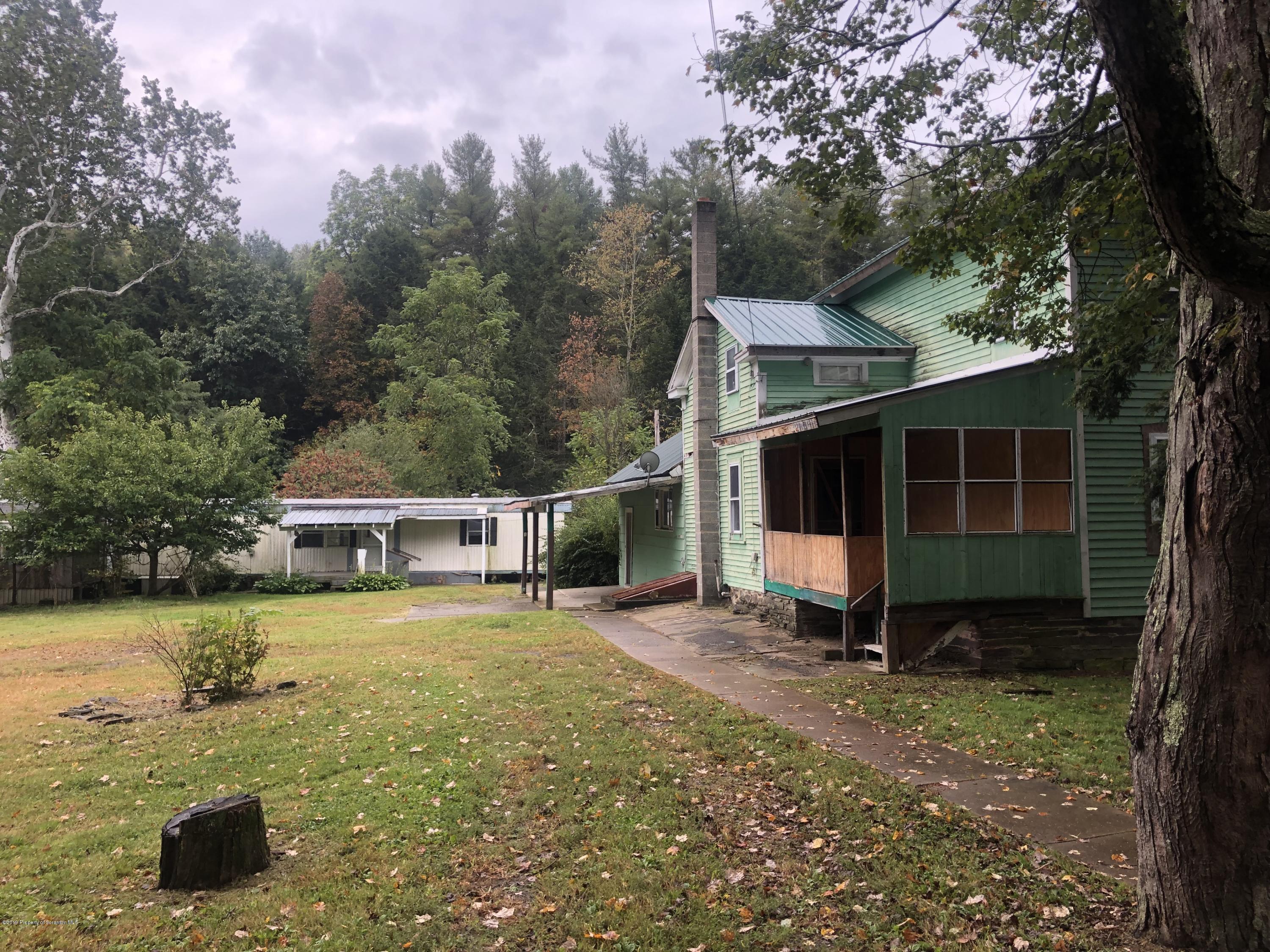 1067 Preacher Brook Road Monroeton, PA 18832 - Photo 1 of 32 a view of a house with a yard balcony and swimming pool