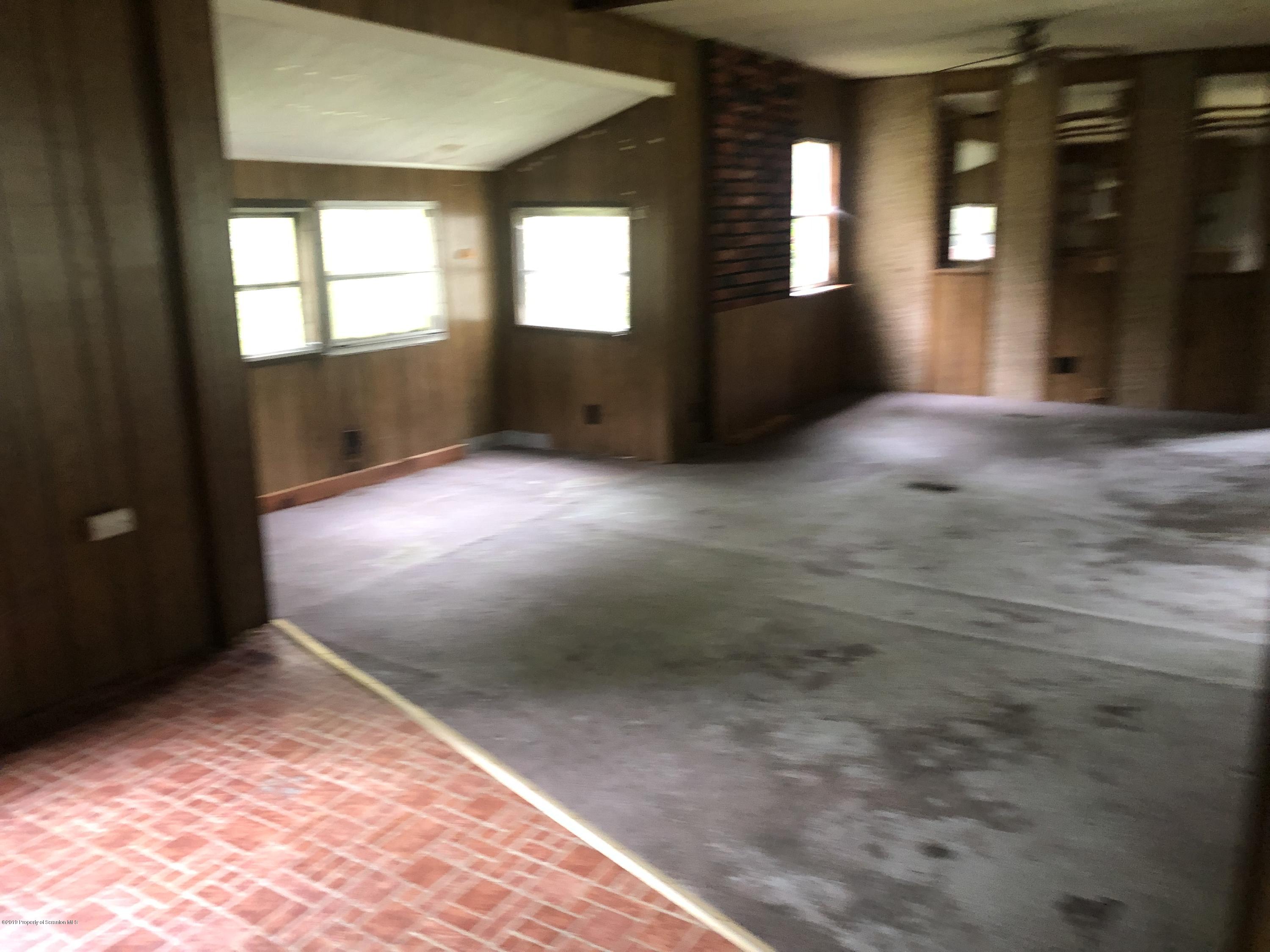 1067 Preacher Brook Road Monroeton, PA 18832 - Photo 30 of 32 an empty room with windows