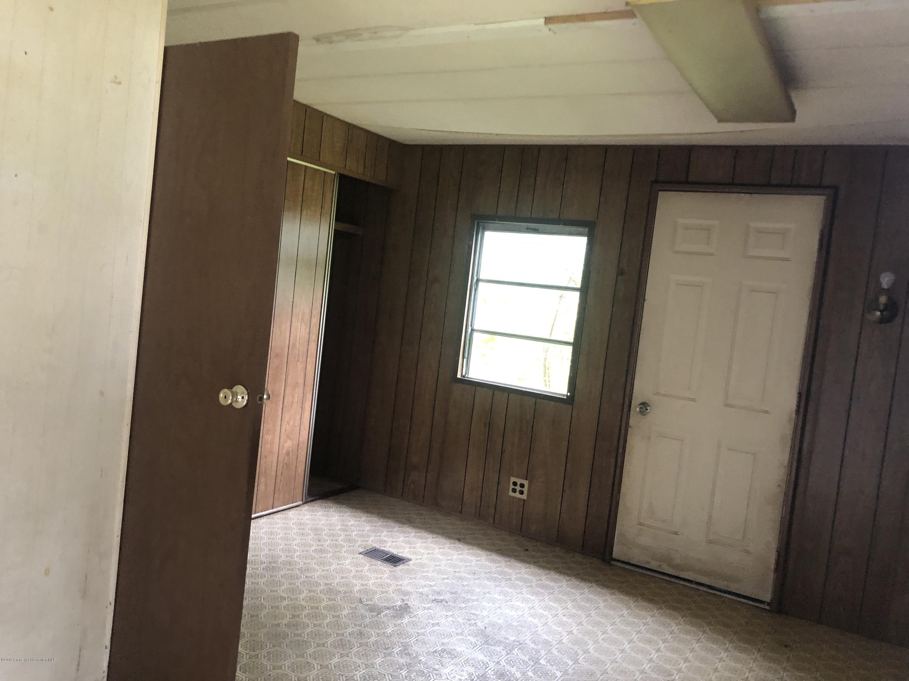 1067 Preacher Brook Road Monroeton, PA 18832 - Photo 31 of 32 a view of an empty room with closet and a window