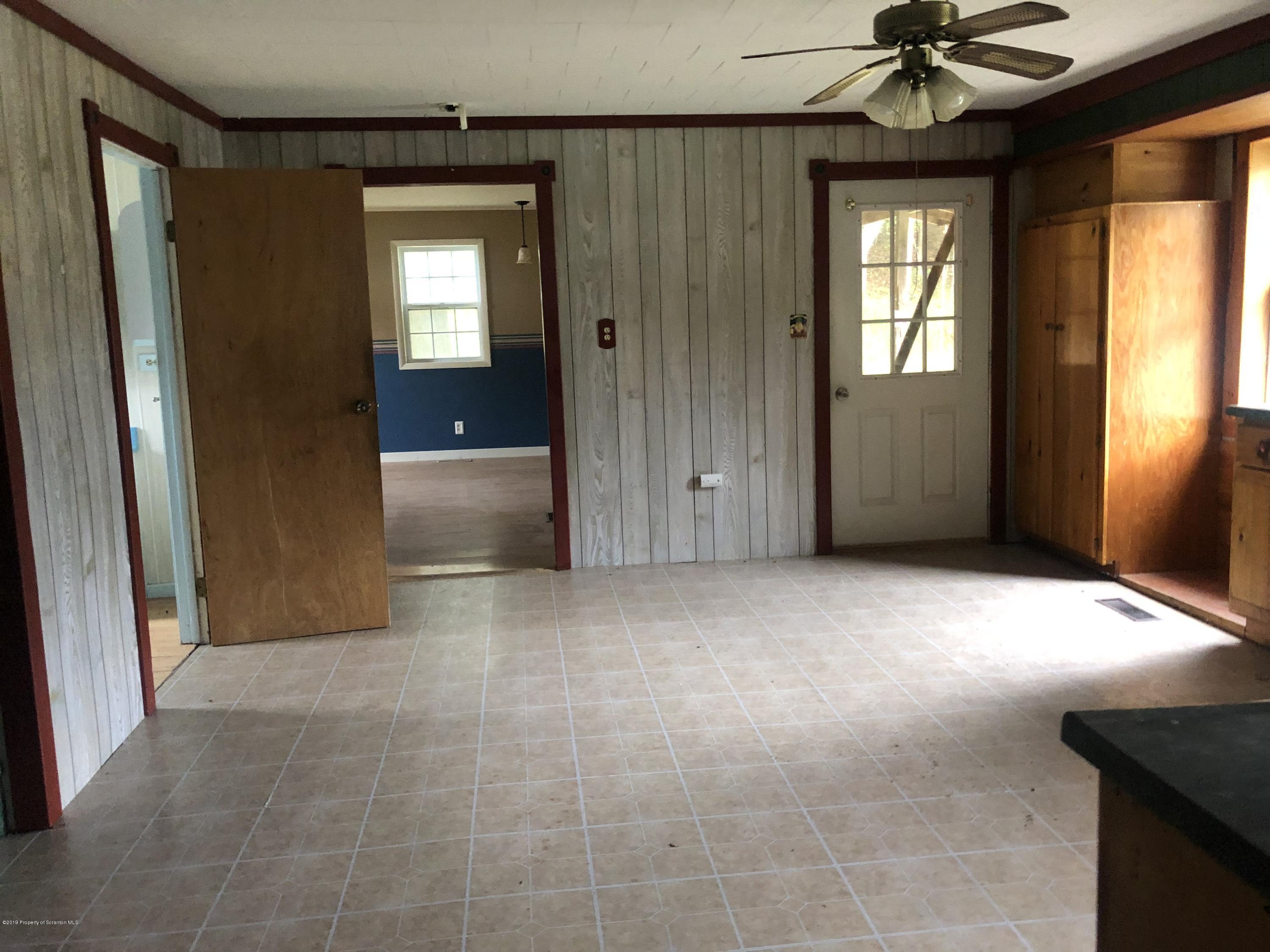 1067 Preacher Brook Road Monroeton, PA 18832 - Photo 5 of 32 a view of an empty room with a window