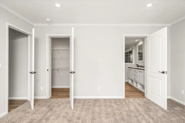 a view of a hallway with wooden shelves