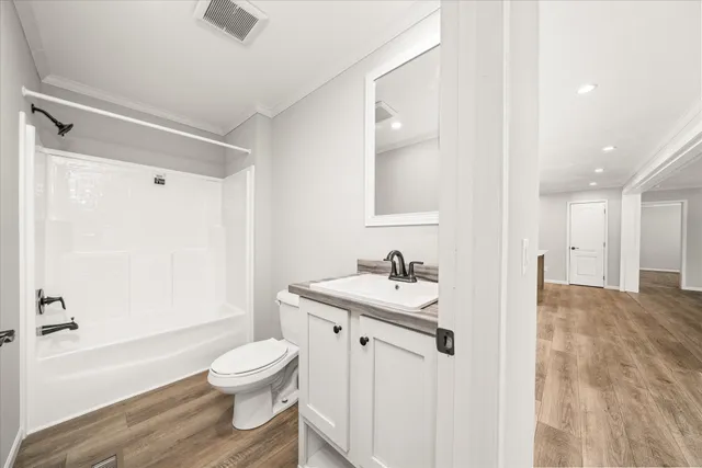 a bathroom with a sink toilet a shower and bathtub