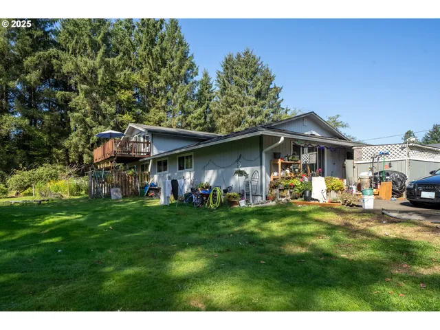 a view of a house with backyard porch and sitting area