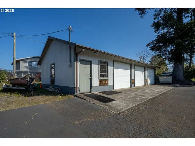 an aerial view of a house with a garden and swimming pool