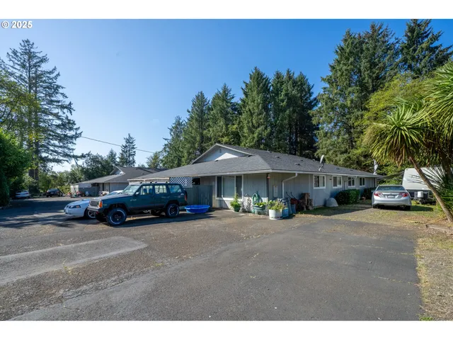 a view of a cars parked in front of a house