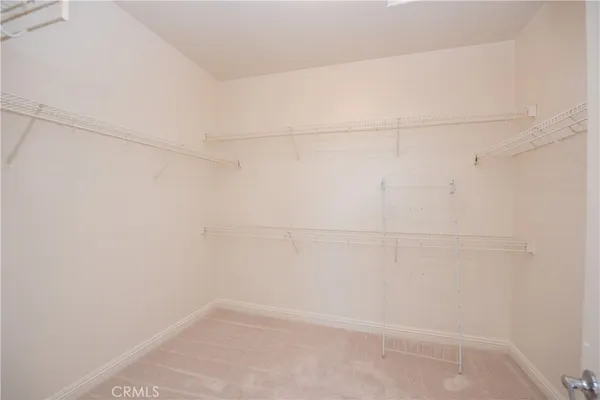a large bathroom with a large mirror vanity and a sink