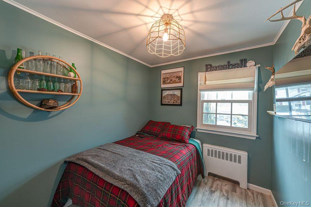 4 Hollyberry Road Plainview, NY 11803 - Photo 11 of 20 a bedroom with a bed and a window