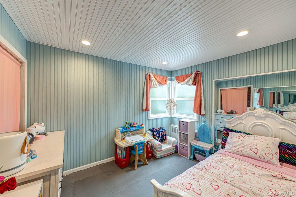 4 Hollyberry Road Plainview, NY 11803 - Photo 12 of 20 a bedroom with furniture and a window