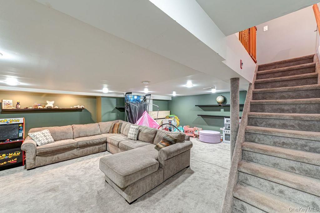 4 Hollyberry Road Plainview, NY 11803 - Photo 14 of 20 a living room with furniture and a couch
