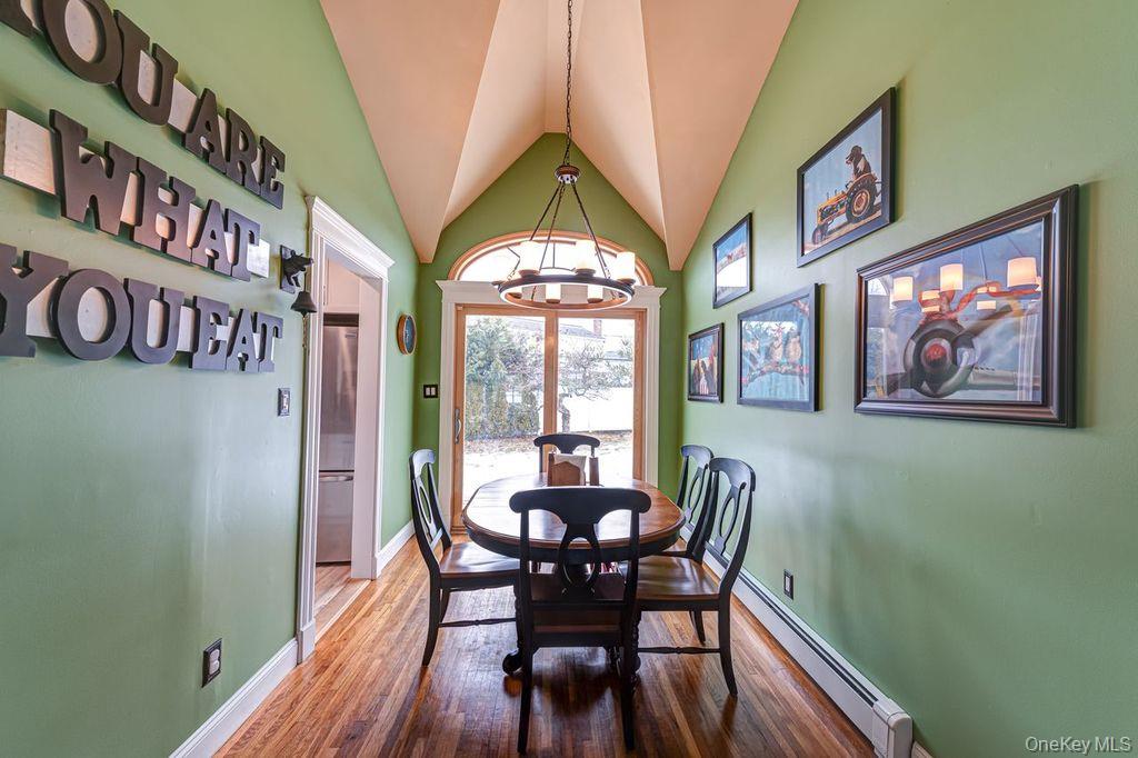 4 Hollyberry Road Plainview, NY 11803 - Photo 6 of 20 a dining room with furniture a rug and wooden floor