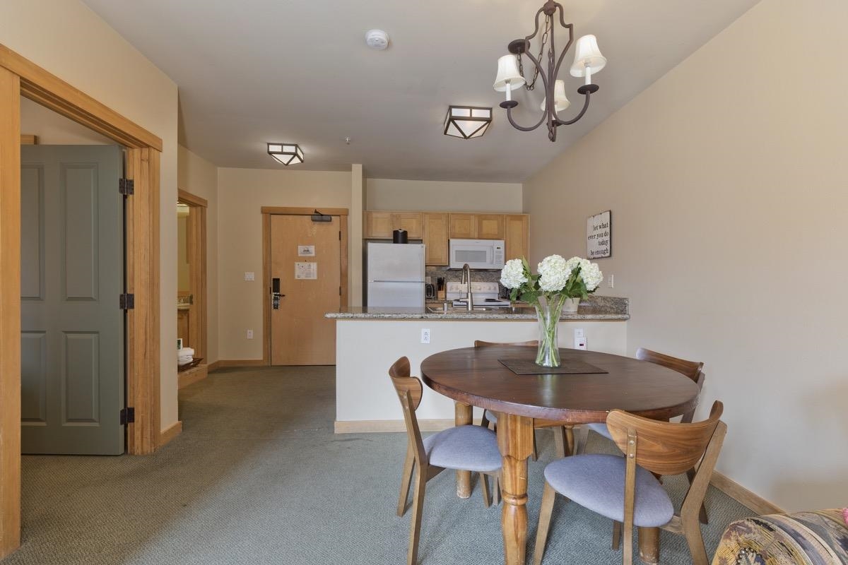 4000 Meridian Boulevard, Unit 436 Mammoth Lakes, CA 93546 - Photo 1 of 46 a dining room with furniture and chandelier