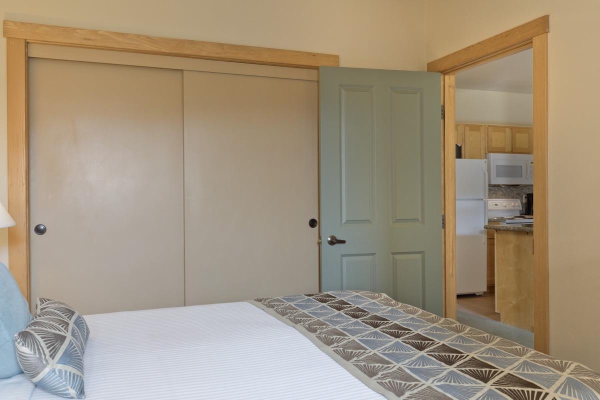 4000 Meridian Boulevard, Unit 436 Mammoth Lakes, CA 93546 - Photo 12 of 46 a bedroom with a bed and a table