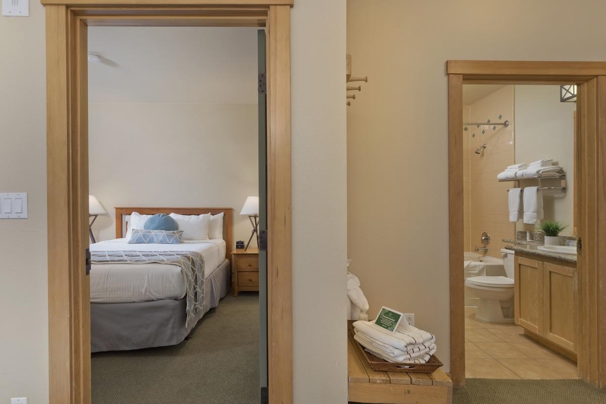 4000 Meridian Boulevard, Unit 436 Mammoth Lakes, CA 93546 - Photo 16 of 46 a bedroom with a bed and a table in it